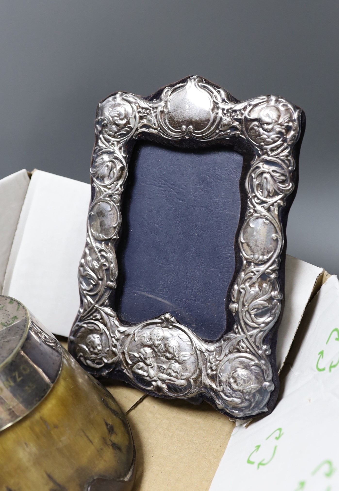 A modern silver mounted photograph frame, a plated mounted horseshoe and three other items.